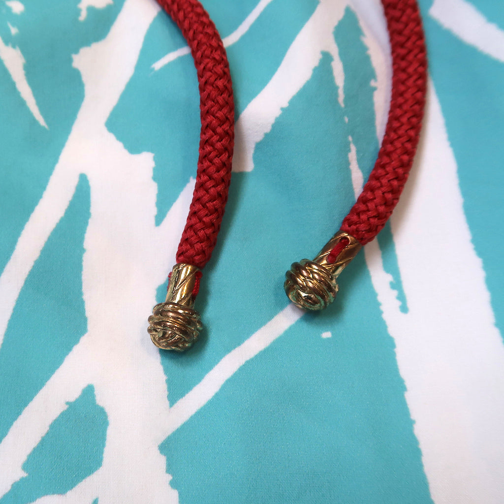 Handcrafted monkey fists knot aglets on Swim Shorts for Men